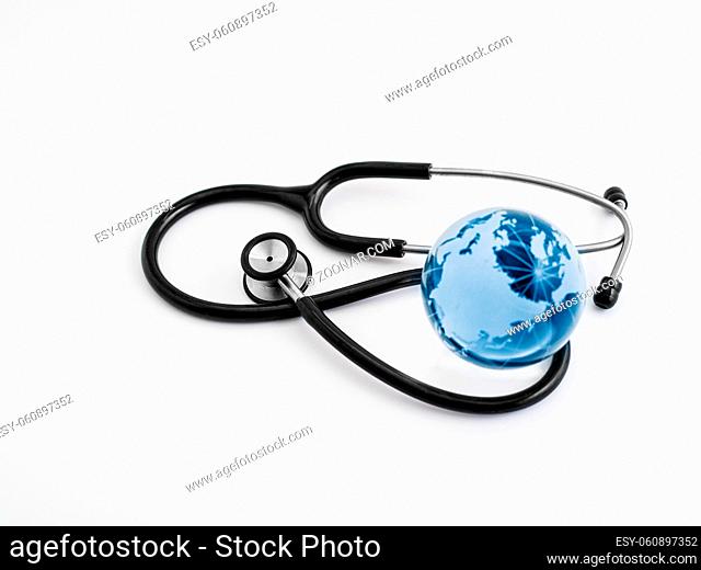 Global healthcare. Globe and stethoscope, studio shot