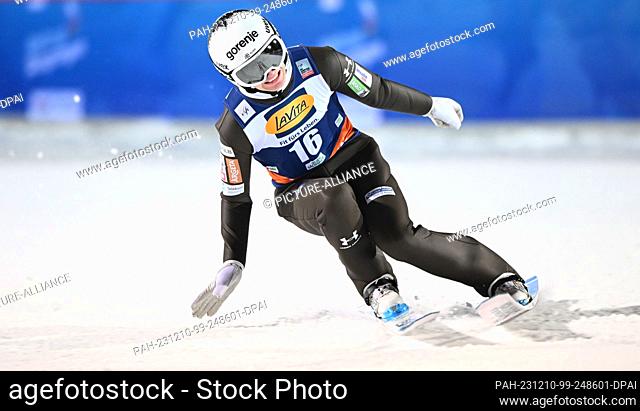 10 December 2023, Saxony, Klingenthal: Nordic skiing/ski jumping, World Cup, large hill, men, 2nd round. Lovro Kos from Slovenia reacts after his jump