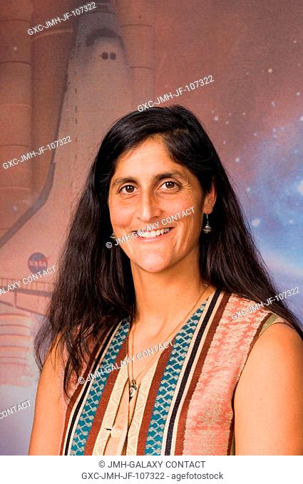 Astronaut Sunita L. Williams, Expedition 14 flight engineer, poses for a portrait following a STS-116 pre-flight press conference at Johnson Space Center