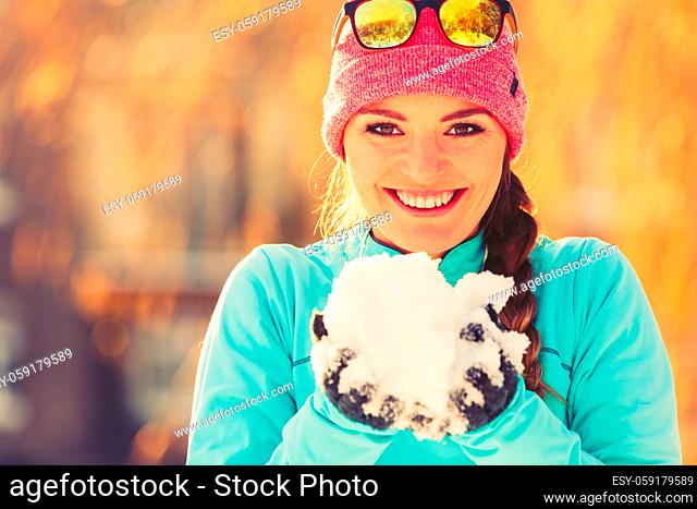 Girl with snow in city. Relax with nature in winter park. Health fitness fashion concept