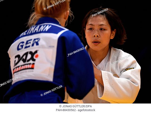 Megumi Tsugane (white, Japan) and Lea Reimann (blue, Germany) fight in the women's 63kg body weight competition at the Judo Grand Prix in the Mitsubishi...