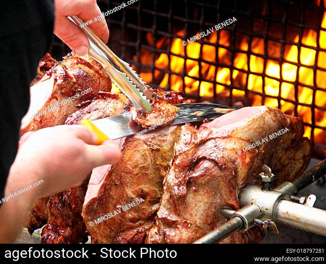 roast meat by fire with flames, traditionally eaten at different family feast