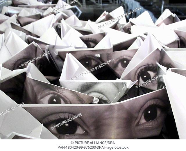 dpatop - 13 March 2018, France, Marseille: Hundreds of eyes printed on paper boats float around a 1400 square meter pool at the harbour