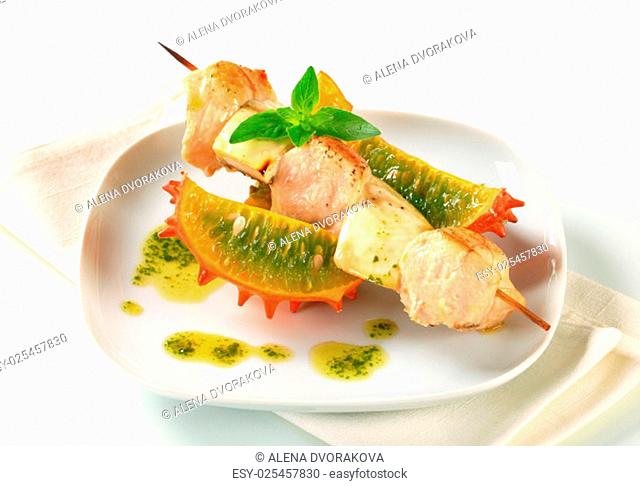 Chicken and aubergine skewer with pesto sauce and Kawani fruit