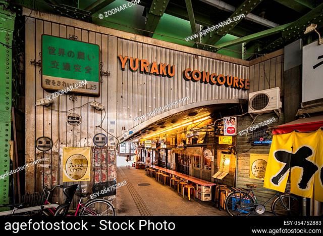 Underpass Yurakucho Concourse under the railway line of the station Yurakucho. Japanese noodle stalls and sake bars revive the nostalgic years of Showa air with...
