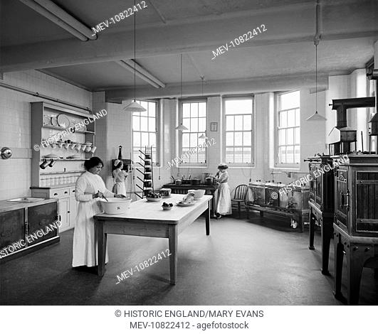 St Andrew's Hospital, Dollis Hill, London. Three female staff working in the kitchen. The hospital was built by the Diocese of Westminster in 1912 for paying...