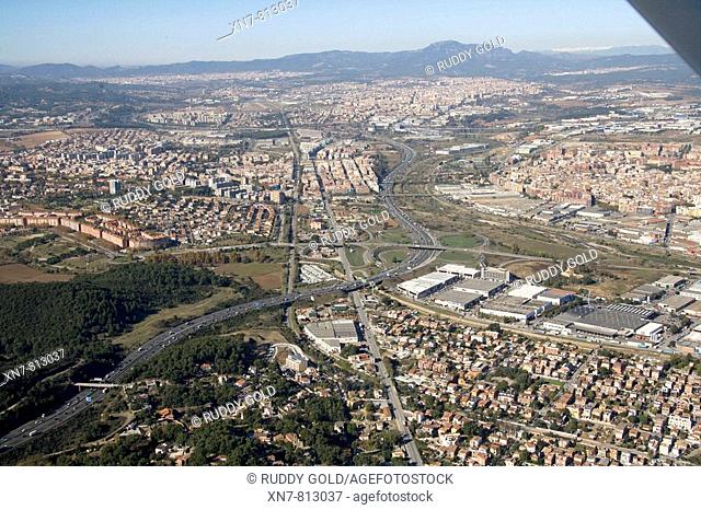 Spain, Catalonia, Barcelona, Barcelonés, Cerdanyola del Vallés (left), Sant Llorenç de Munt (top), N-150 road and C-58 freeway (autopista del Vallès)