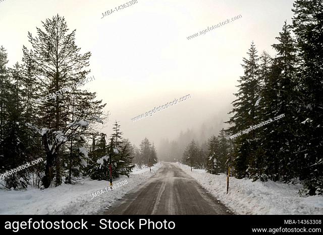 The toll road between Wallgau and Vorderriss on the edge of the Karwendel in the German-Austrian Alps in winter during snow and black ice