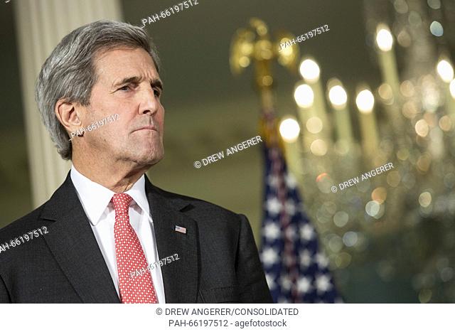 United States Secretary of State John Kerry looks on as U.S. President Barack Obama makes a statement after meeting with his National Security Council at the...