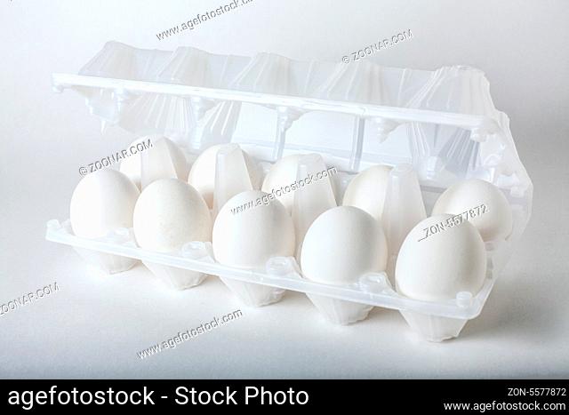 six eggs in a transparent plastic egg box