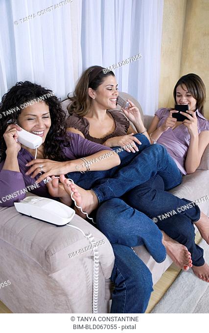 Multi-generational women using different phones