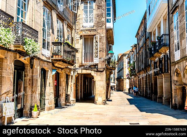 Santiago de Compostela, Spain - July 18, 2020: Old street with arcades in medieval town