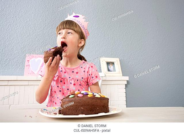 Girl eating her birthday cake