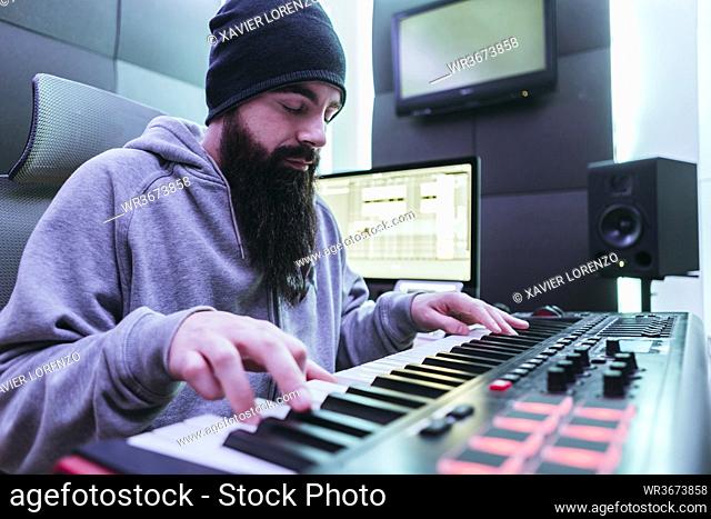 Dj producing music in his studio