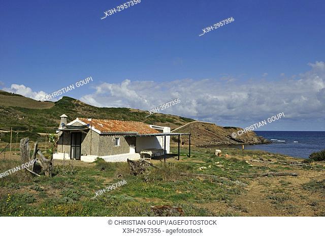 fisherman house at Cala Mica inlet near Cape Cavalleria on the North Coast of Menorca, Balearic Islands, Spain, Europe