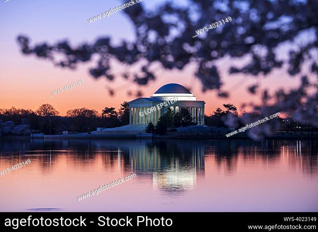 The Jefferson Memorial is illuminated by pre-dawn light as the sun rises over the Tidal Basin on the National Mall in Washington, D. C