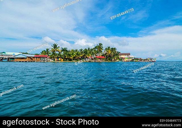 Bocas Del Toro, Panama: August 23, 2019: Colorful Caribbean buildings over the water with boats at dock, Bocas del Toro, Panama