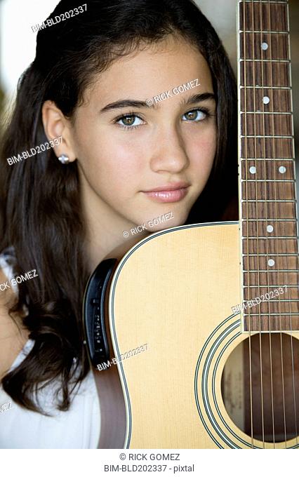 Colombian girl holding guitar