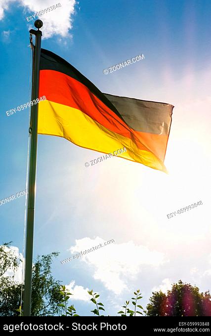 German Flag Black Red Gold Patriotic Symbol on Blue Sky Background