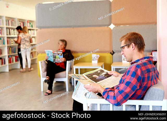People reading in library