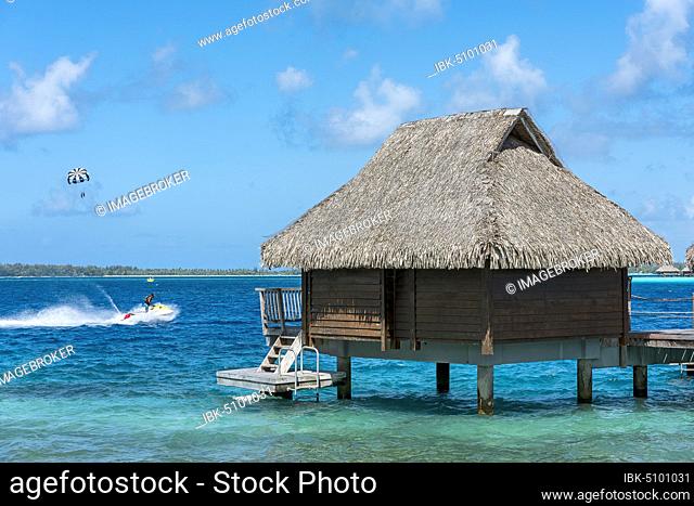 Water sports and overwater bungalow in the lagoon, Maitai hotel complex, Bora Bora, French Polynesia, Oceania