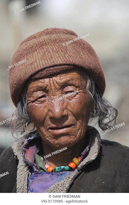 An elderly Ladakhi woman from the Zanskar region outside her home in a small village in Rangdum, Ladakh, Jammu and Kashmir, India