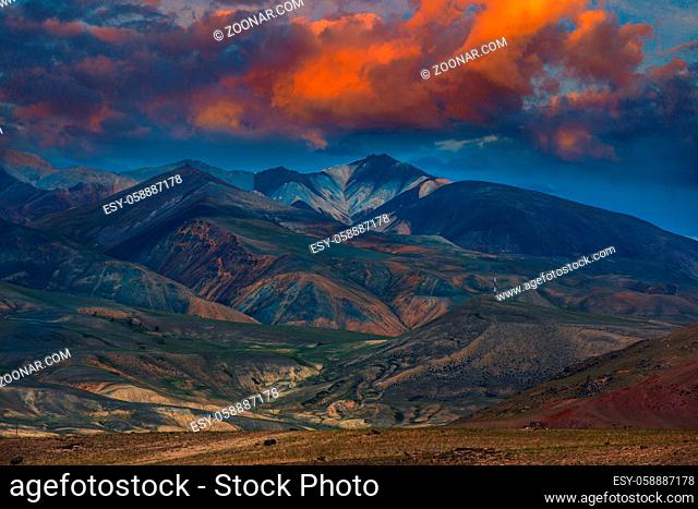 Different colored mountains with beauty sunset sky in Mongolian Altai mountains