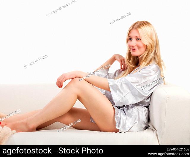 portrait of beautiful sexy blonde woman in pajamas lingerie on white background