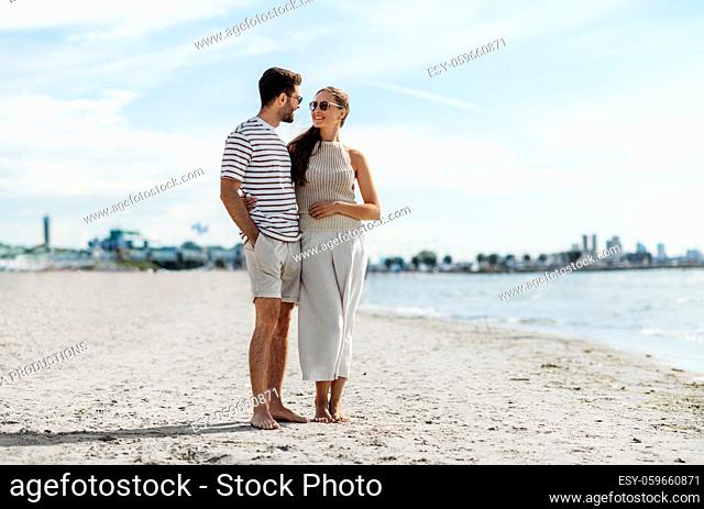 happy couple on summer beach