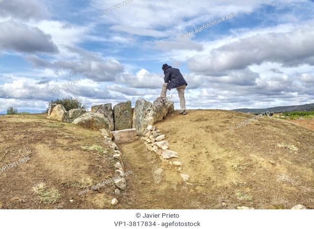 A visitor contemplates the Dolmen of San Adrián. Granucillo de Vidriales. Benavente and the Valles region. Zamora. Castile and Leon. Spain