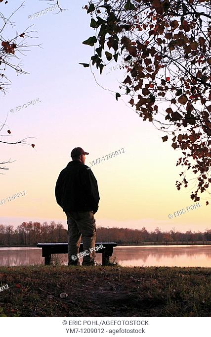 Hiker Watching the Sunset - George Bush Park, Harris County, Texas  Lake near the Noble Road Trail