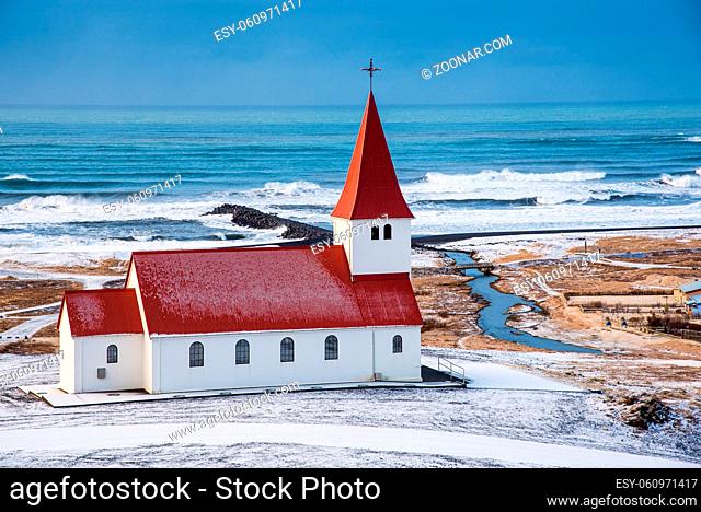 The picturesque Vik I Myrdal church at the top of the hill offering picturesque images of the atlantic ocean and the village of vik in Iceland