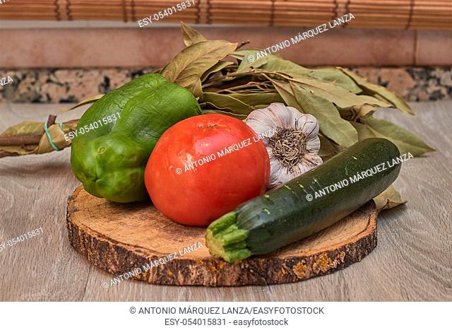 Vegan food, tomato , zucchini , garlic , pepper and laurel