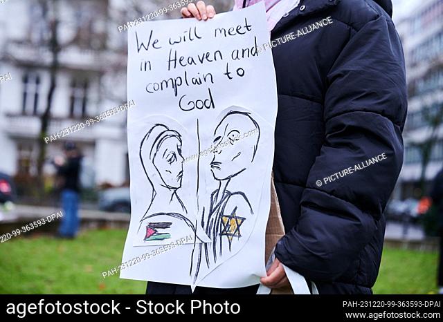 20 December 2023, Berlin: ""We will meet in Heaven and complain to God"" is written above a drawing of a grieving woman with a Palestinian flag on one side and...