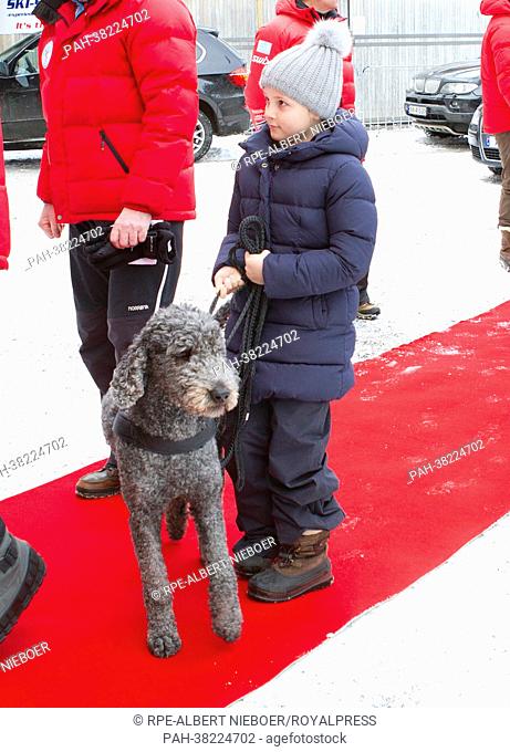 Princess Ingrid Alexandra with the labradoodle Milly Kakao of the royal family during their arrival at the ski jumping championship at Holmenkollen near Oslo