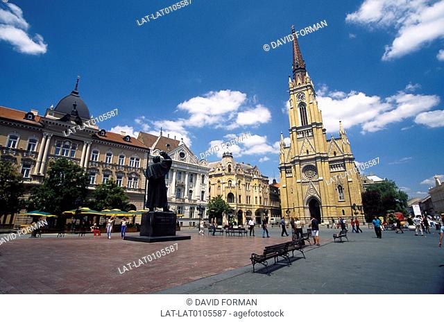 Petrovardin, citadel. Town on river Danube. Square. Church, tower. Statue. Facade of building