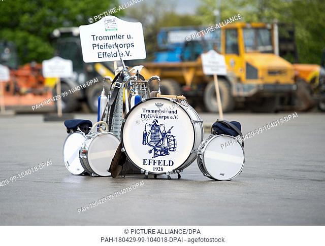 29 April 2018, Schmallenberg, Germany Musical instruments with a sign of the drummer and Piperkorp Effeld e.v on the ground at the site of the Parade