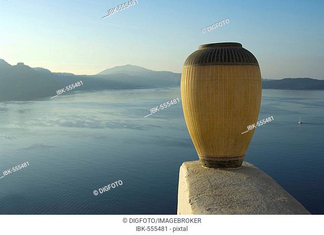Earthenware jug in fornt of the caldera, Oia, Santorini, Cyclades, Aegean Sea, Greece