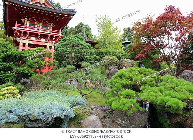 Japanese pagodas and stone lantern in a landscaped Japanese garden in California, USA