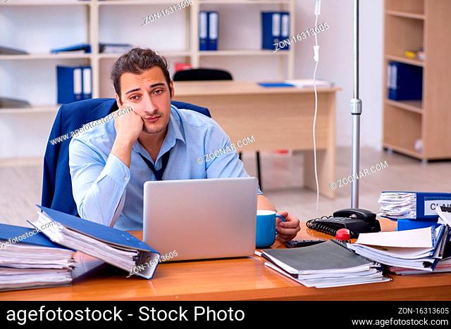 Male employee suffering at workplace