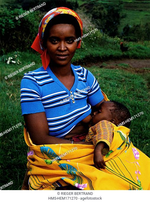 Burundi, Bujumbura Province, surroundings of Ijenda, nursing Tutsi mother with her baby