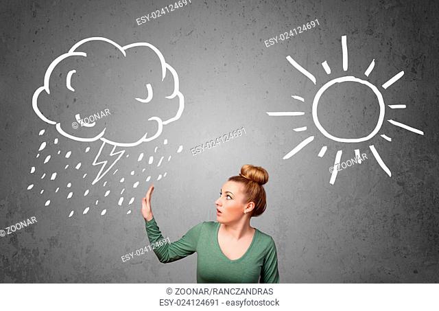 Woman standing between a sun and a rain drawing