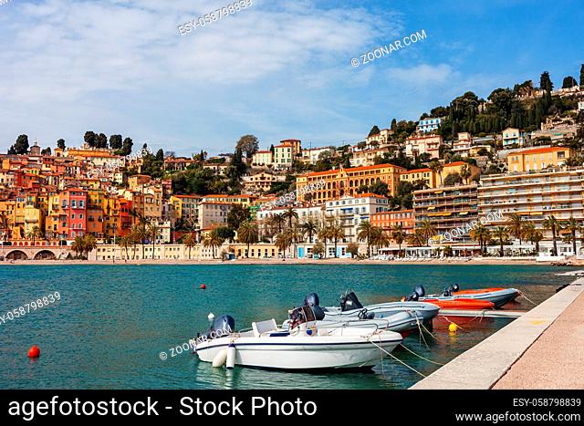 France, Cote d'Azur, Menton skyline and boats at bay waterfront, resort town on French Riviera at Mediterranean Sea