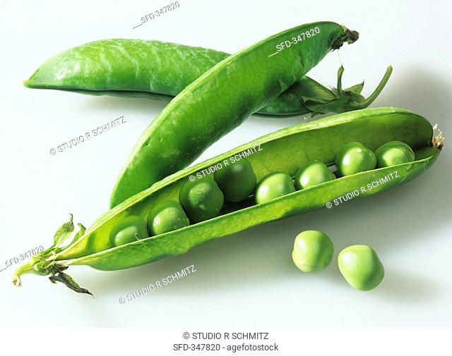 Three pea pods against a white background