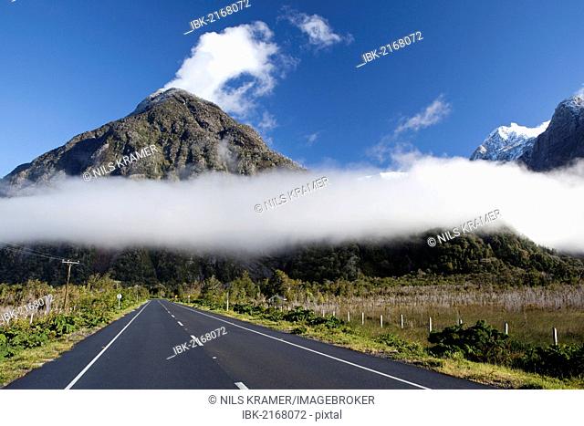 Low-hanging clouds moving through the Patagonian Andes over the Pan-American Highway, Carretera Austral, Ruta CH7, Region de los Lagos, Patagonia, Chaiten