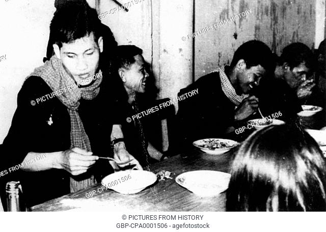 Cambodia: Khmer Rouge prison staff eating communally, Tuol Sleng (S 21) Prison
