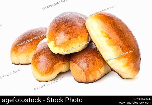 Heap of baked pies isolated on a white background