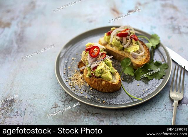 Avocado crostini with Dukkah, chilli and coriander