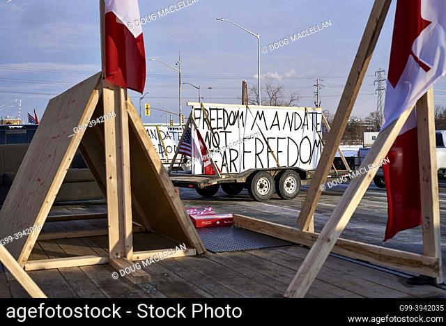 Signs on a closed road from the Freedom Convoy blocking traffic to and from the United States on 08 February 2022 near the Ambassador Bridge in Windsor