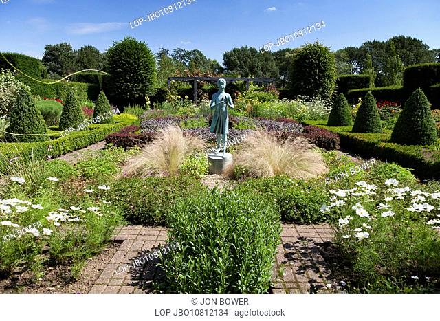 The sculpture of the little blue girl in Waterperry Gardens